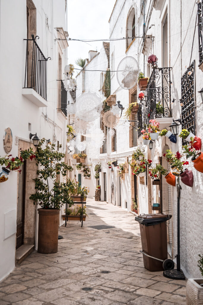 Alley with flowers in Locorotondo